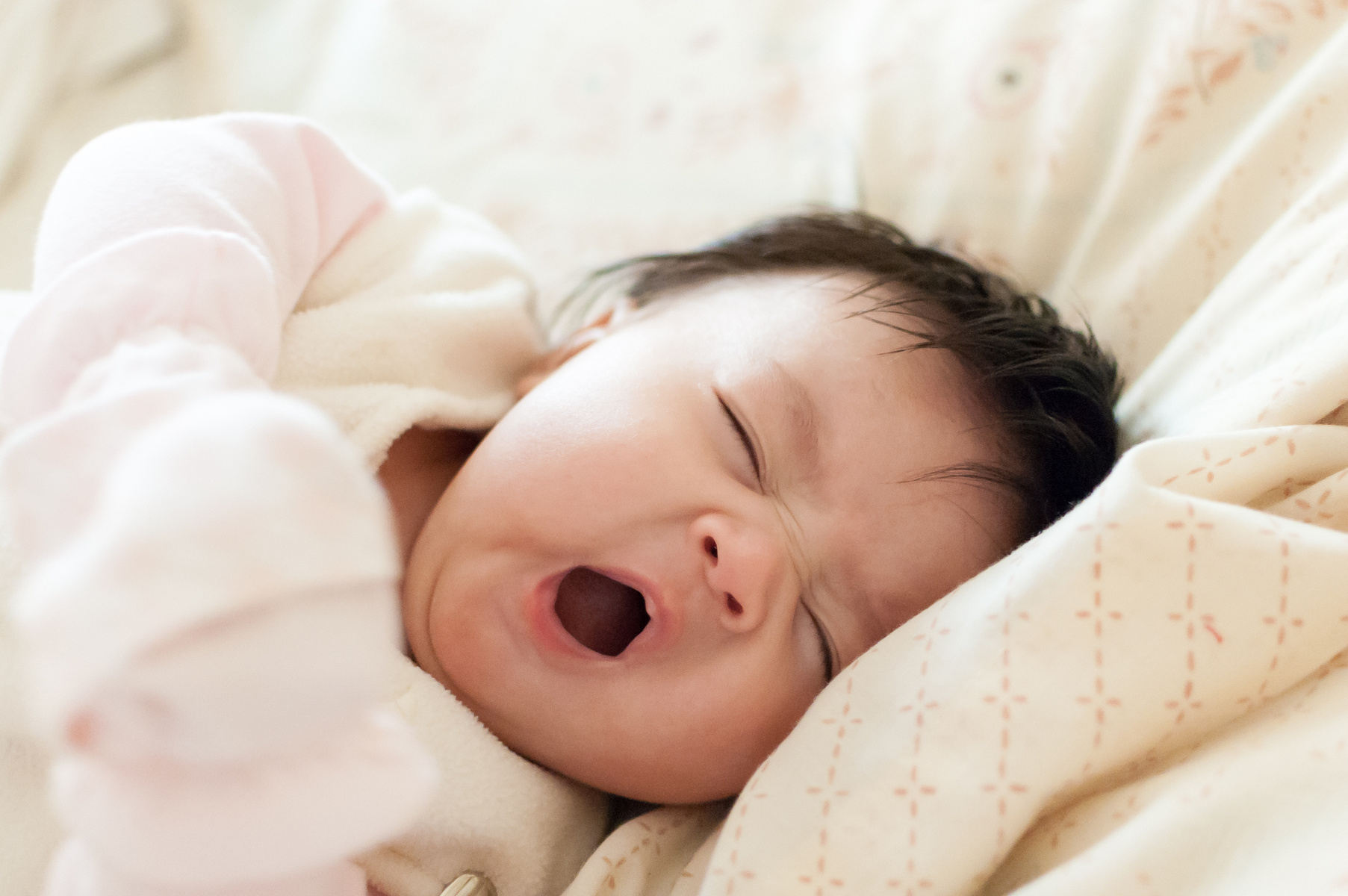 Cute sleepy baby yawning